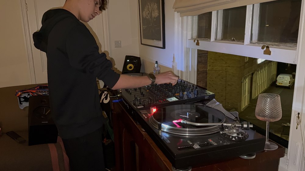 Hands on the mixer, working.